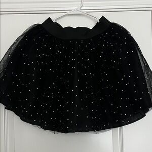 Black tulle tutu style skirt with elasticated waist and pearl beading.